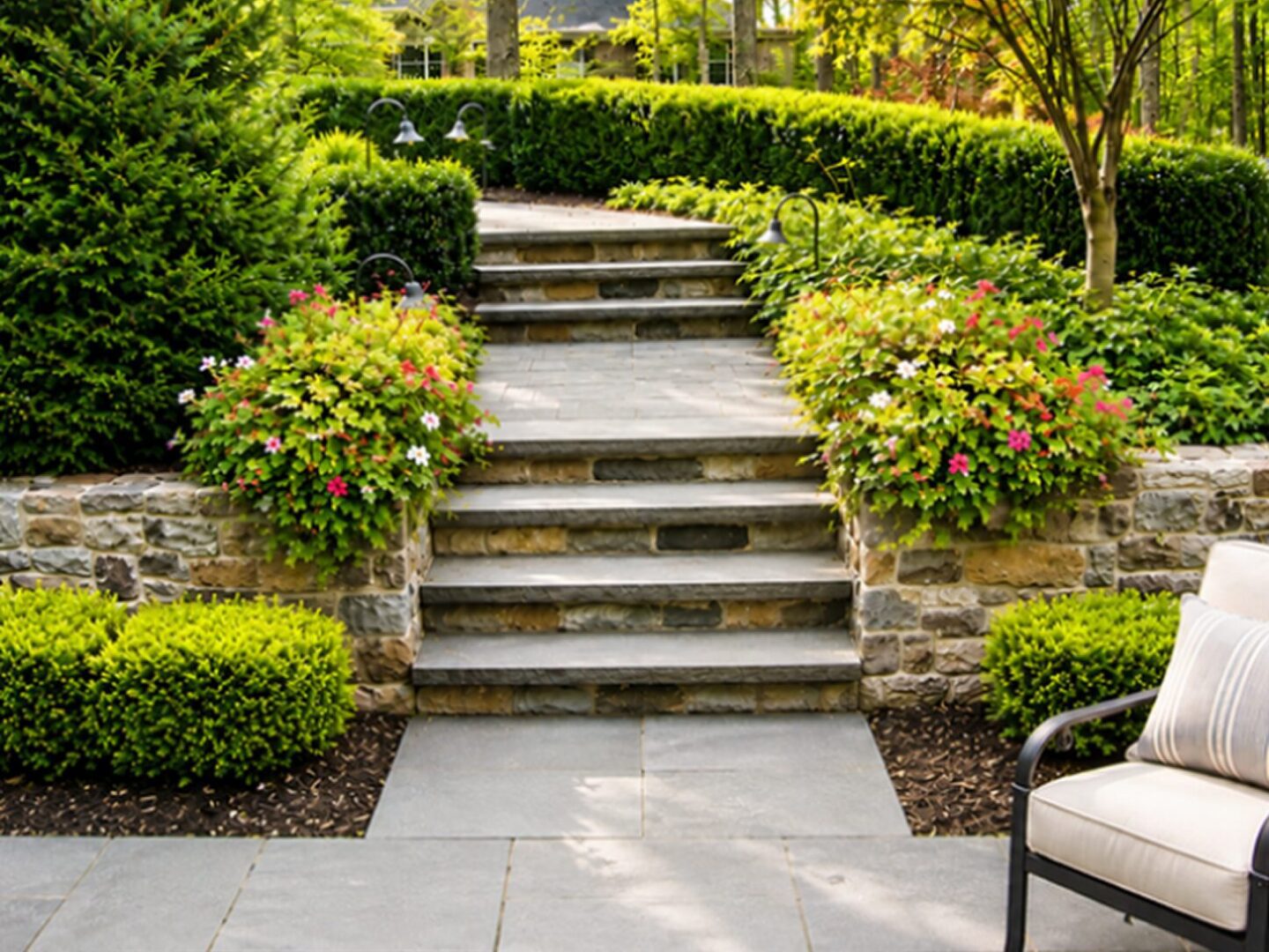Stone garden steps with lush greenery.